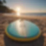 A vibrant soft top surfboard on a sunny beach