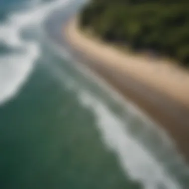 Aerial view of surfers catching waves at Playa Biesanz in Quepos, Costa Rica