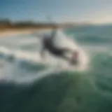 Aerial view of a kiteboarder soaring over the waves