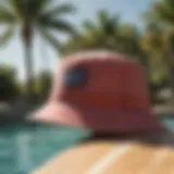 Stylish Billabong Still Single Bucket Hat displayed on surfboard