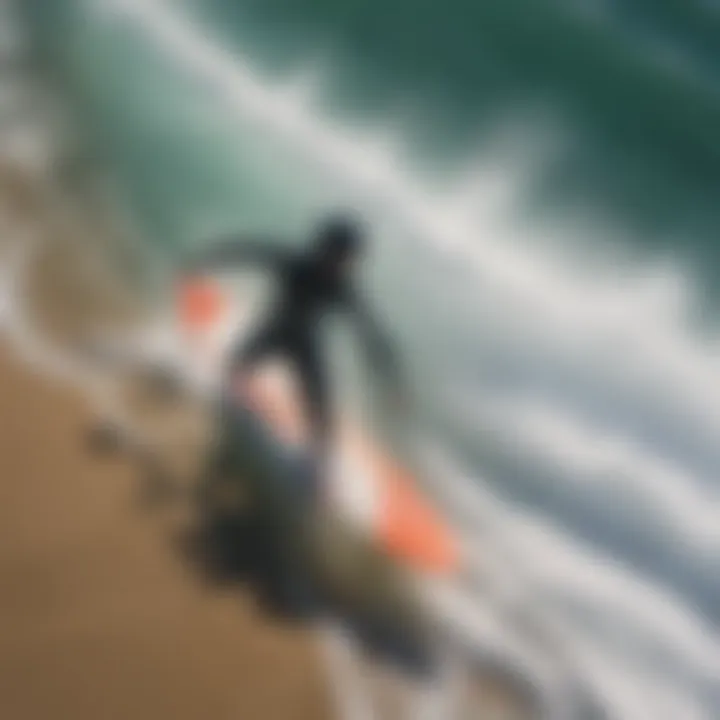 Aerial view of a person wearing a carve swim top in the midst of surfing waves