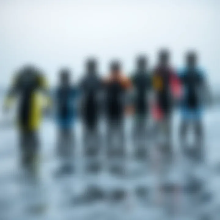 Different types of wetsuits arranged to display thickness variations