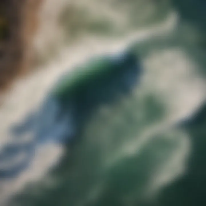 Aerial view of a coastline with perfect barreling waves forming