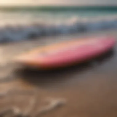 Colorful surfing change mat rolled up near ocean waves