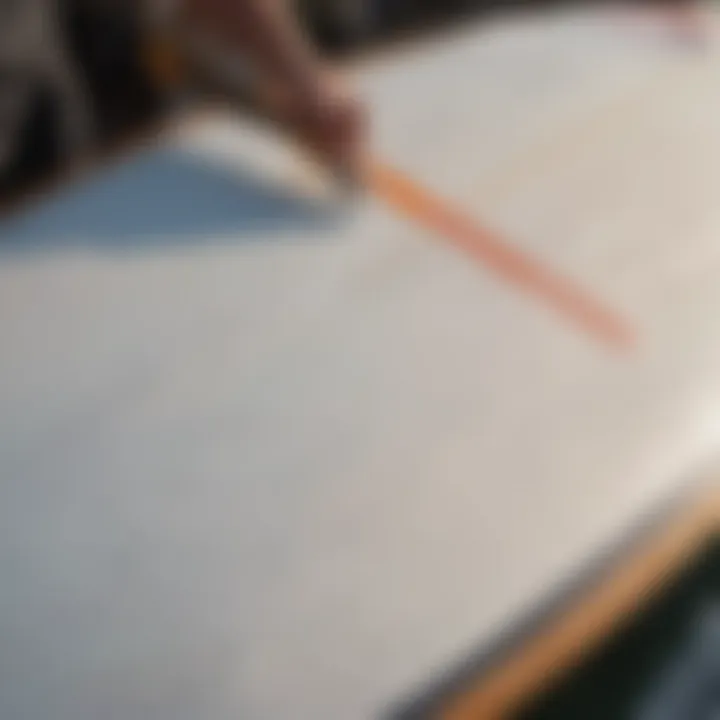 Close-up of a surfboard being cleaned