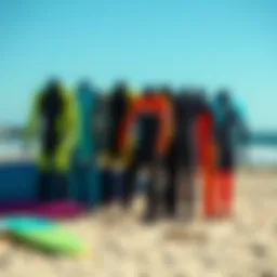A vibrant selection of top surfing suits displayed on a beach