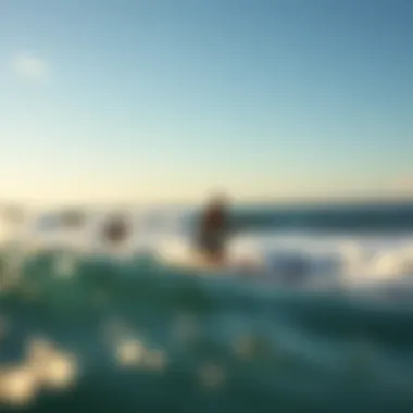 A scenic beach setting with surfers catching waves.