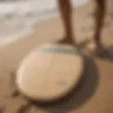 Diverse types of skimboards displayed on a sandy beach