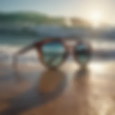 Electric Encelia sunglasses displayed against a backdrop of ocean waves