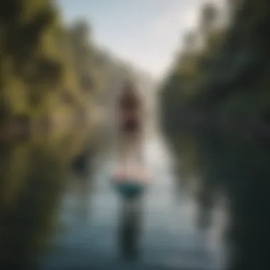 A paddle boarder practicing techniques in calm waters