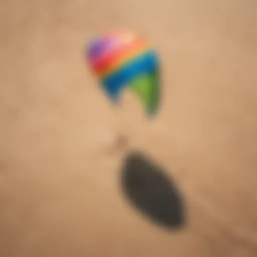 Aerial view of a colorful kiteboarding kite on a sunny beach