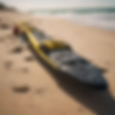 Close-up of kitesurfing equipment ready for use on the sandy shoreline