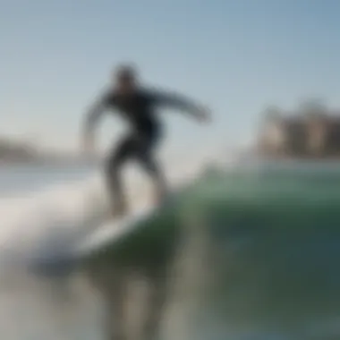 Lone surfer riding a wave at Venice Beach