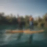 An array of stand-up paddleboards showcasing various sizes and shapes against a serene water backdrop.