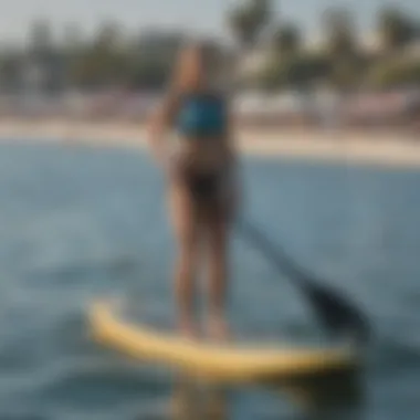 Participants enjoying a local water sports event with paddle boarding and kayaking