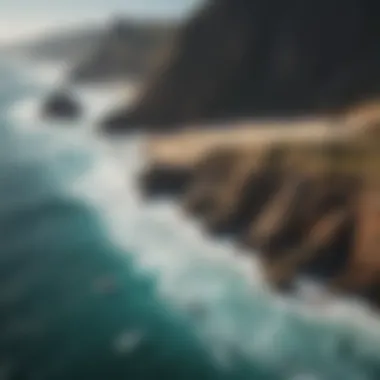 Aerial view of a rocky coastline with surfers in the water