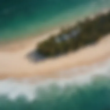 An aerial view of a popular surf spot in Belize, showcasing waves and sandy beaches.