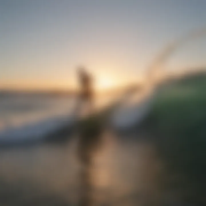 Surfer catching a wave at sunrise