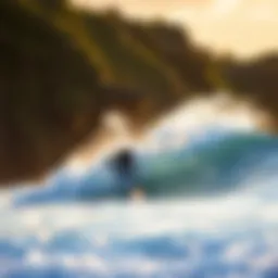 Surfer catching a wave at Polihale Beach