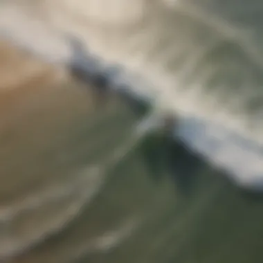 Aerial view of surfers riding waves at Playa Tamarindo