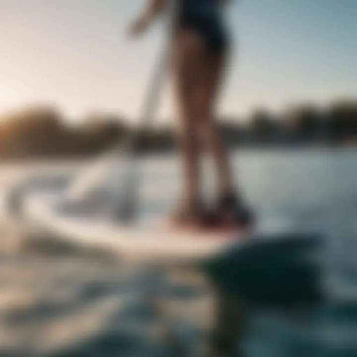 An athlete gracefully gliding over water on a SUP hydrofoil, demonstrating performance and agility.