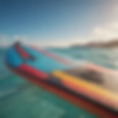 Close-up of colorful kite surfing board against crystal clear ocean backdrop