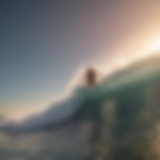 Aerial view of a surfer catching a wave at sunset