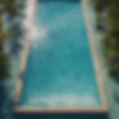 Aerial view of a wave pool with crystal clear blue water and palm trees