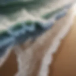 Aerial view of a beach with dynamic waves crashing onto the shore
