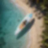 Aerial view of a sleek paddle board on crystal clear waters