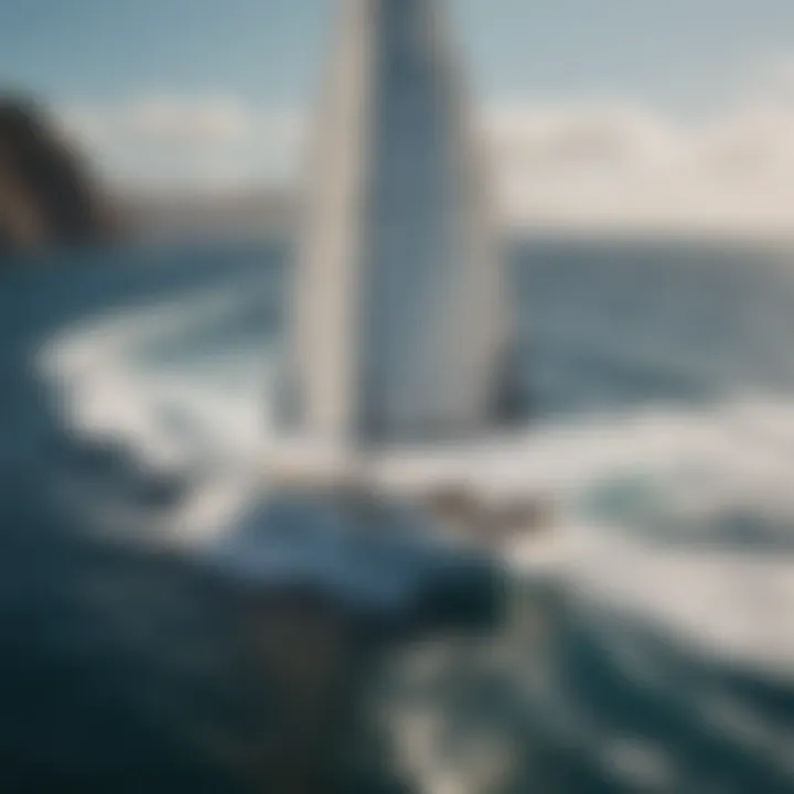 Aerial view of wind surf sailing yacht racing across the ocean