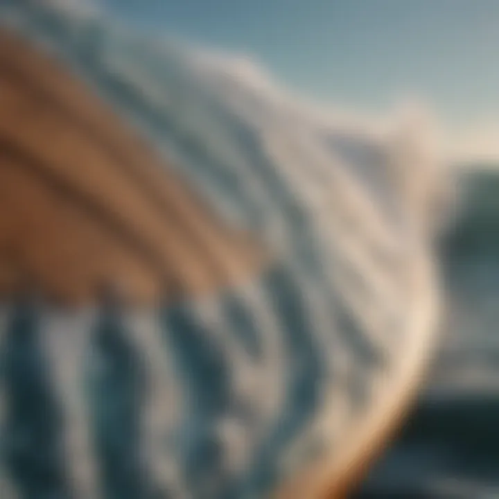 Close-up of intricate surfboard design with ocean waves motif