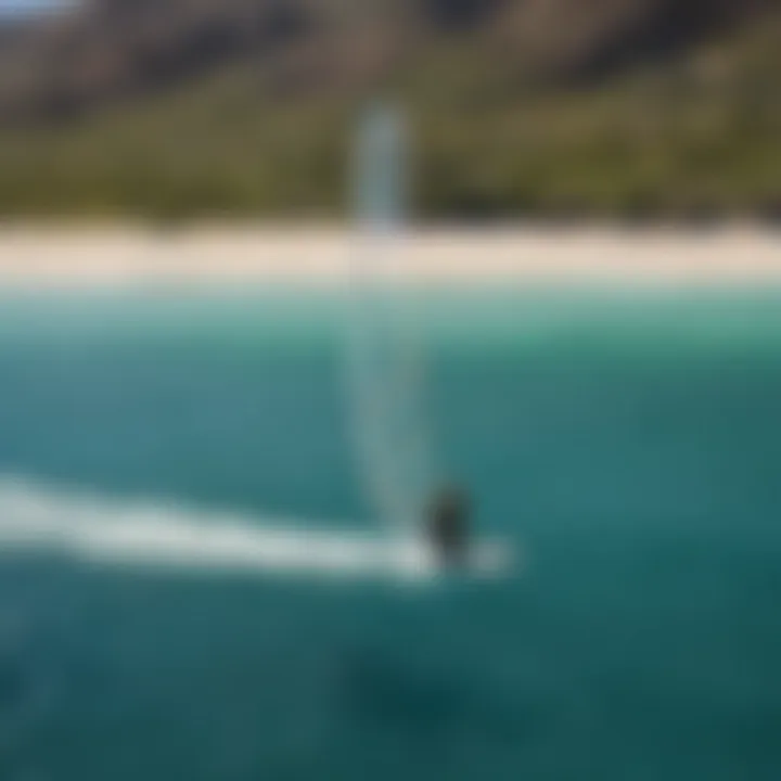 Kite surfer soaring over the turquoise waters of Las Barriles