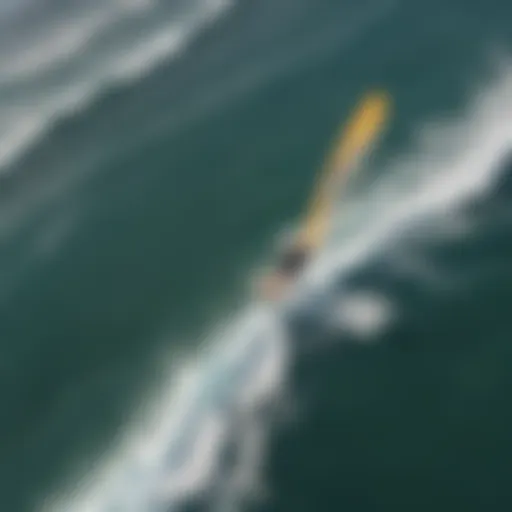 Aerial view of a kite surfer riding the waves in Maui