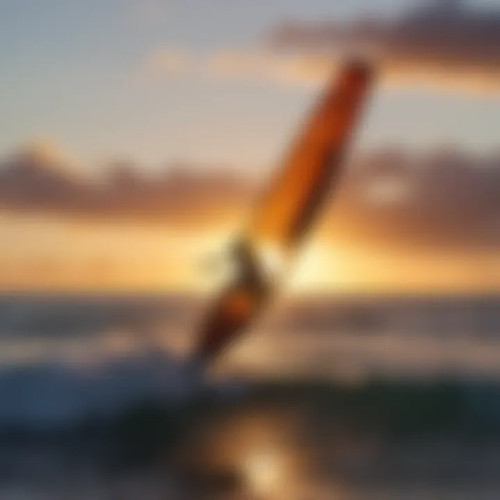 Sunset silhouette of a kite surfer on the waves of Maui