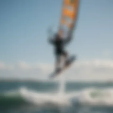 Kiteboarder catching air while soaring above the water