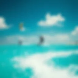 Kitesurfers gliding over crystal clear waters of Aruba