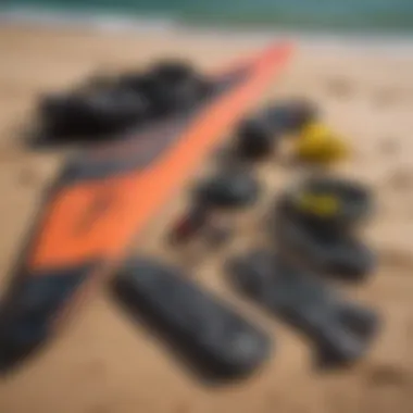 Close-up of kitesurfing gear laid out on the beach, showcasing essential items