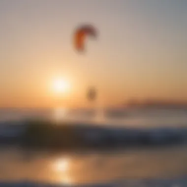 A breathtaking view of a kitesurfer gliding across the waves during sunset