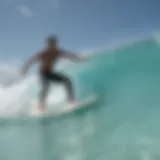 Surfer catching a wave on turquoise waters