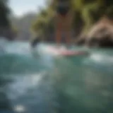 A paddle boarder navigating through crystal clear waters