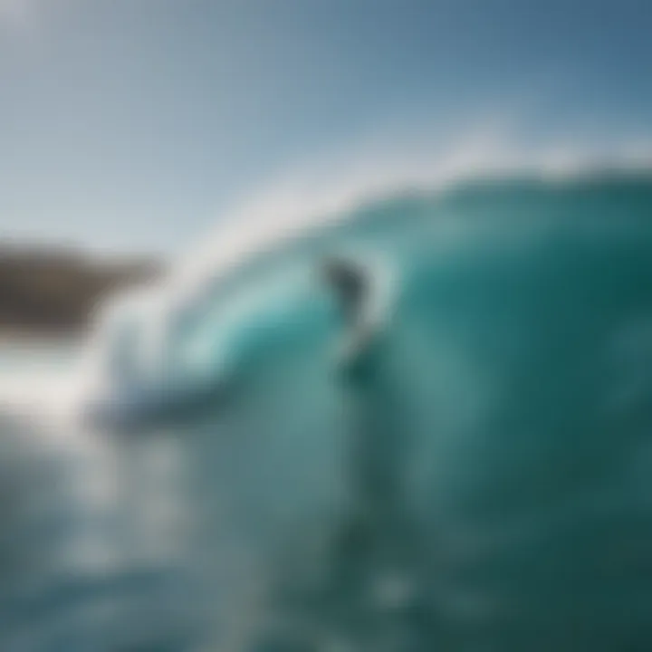 Surfer executing a perfect bottom turn on a turquoise wave