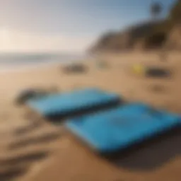 Different sizes of boogie boards displayed on a sandy beach