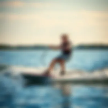 Young Rider on Water Youth beginner riding a wakeboard on a calm lake