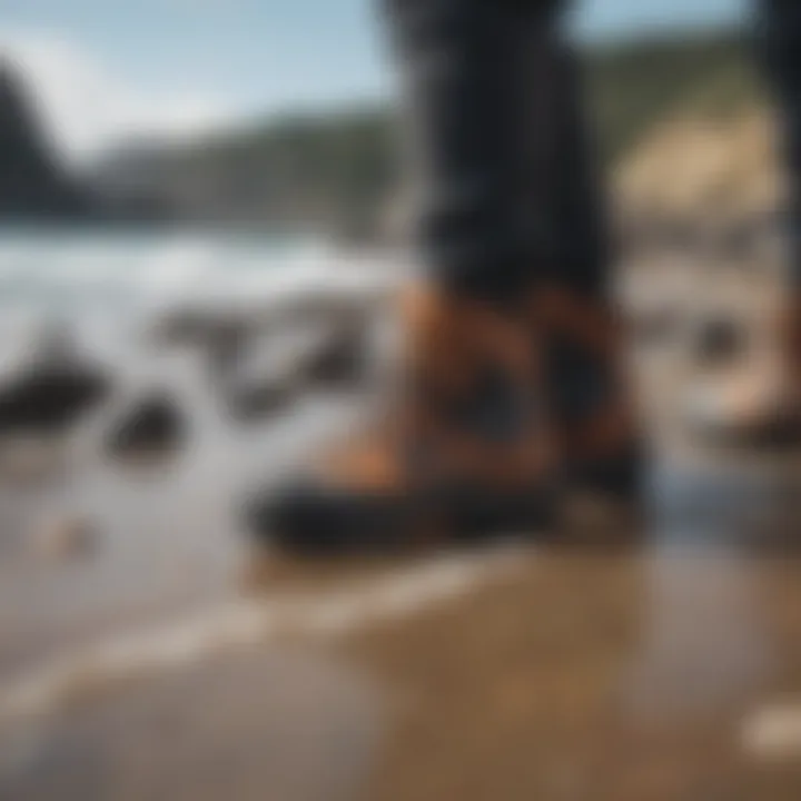 A pair of surfing booties on rocky shore