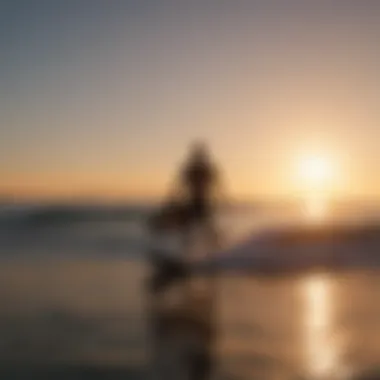 Silhouette of a surfer with a backdrop of a setting sun