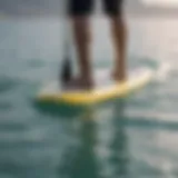 Close-up of a punctured inflatable paddle board showing damage