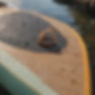 Materials laid out for repairing a paddle board including patches and adhesive