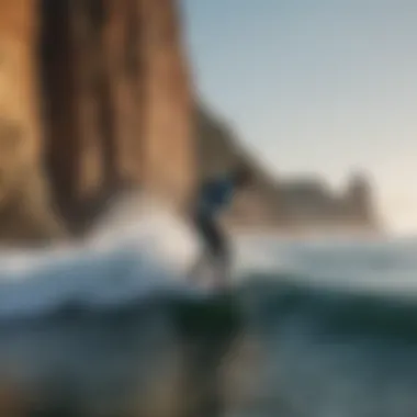 Surfer in action with Punta Roca's iconic rock formation