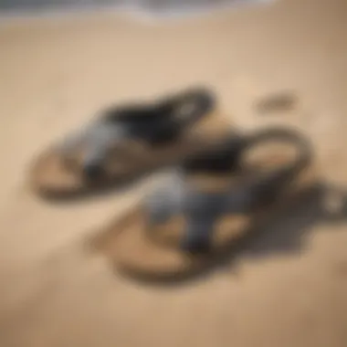 Stylish Reef Ahi sandals displayed on a sandy beach